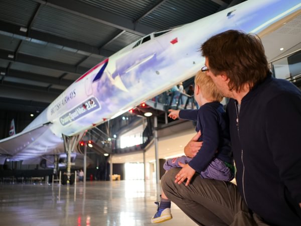 Father and son admiring Concorde at Aerospace Bristol